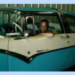Sydney in a 55 Ford Crown Vic.