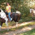 Nikki riding her horse on a Mock search. That is me in back riding Spirit.